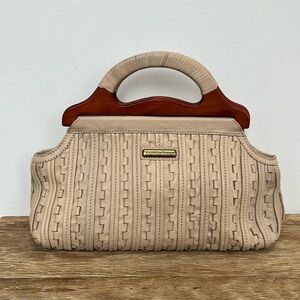 Isabella Fiore woven cream leather bag with wooden handle.